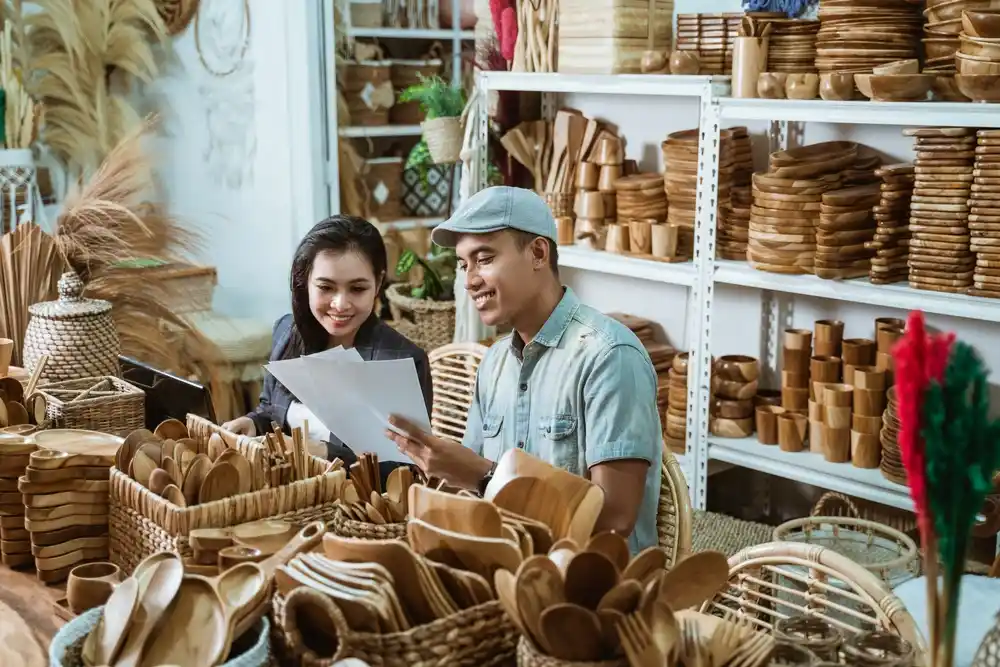 business owners looking at craft store inventory